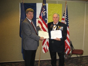 President Walden presents the Streamer and Certificate for Flag Certificates presented to John Reinert. 