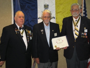 President Walden and Robert Chandler present the NESSAR Flag Award to Merle Rudebusch.