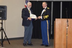 Member Robert Chandler accepts an Meritorious Service Award from President Hoke